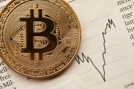 Gold Bitcoin on the background of the chart.の写真素材