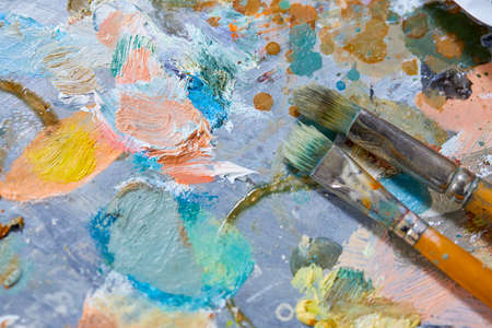 Tubes of oil paint and artist paint brushesの写真素材