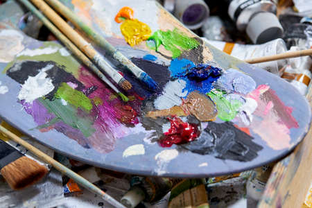 Tubes of oil paint and artist paint brushesの写真素材