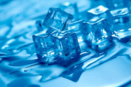 ice cube on the blue backgroundの写真素材