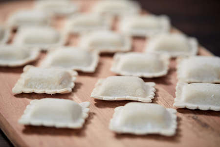 raw dumplings on teh wooden boardの写真素材