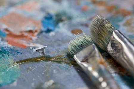 Tubes of oil paint and artist paint brushesの写真素材