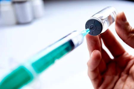 Vaccine in vial with syringeの写真素材