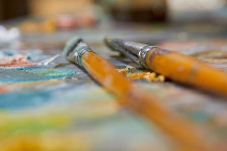 Tubes of oil paint and artist paint brushesの写真素材