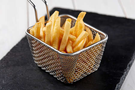 fried french fries in the basketの写真素材