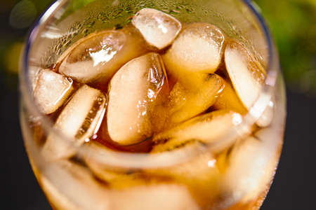 Ice cubes in cola beverageの写真素材
