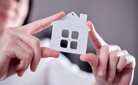 Hand Holding White Icon Houseの写真素材