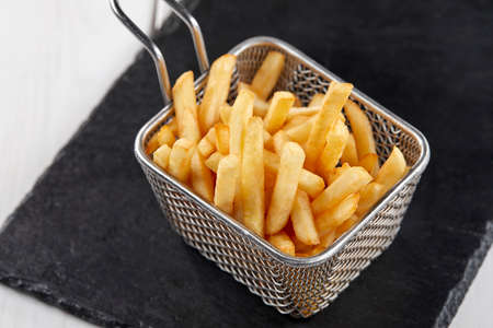 fried french fries in the basketの写真素材