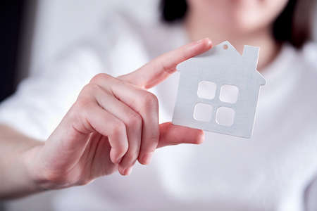 Hand Holding White Icon Houseの写真素材