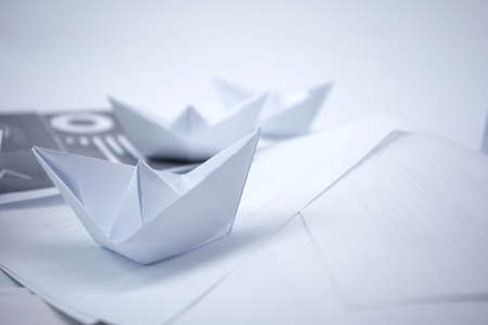 business concept, paper boats on the documentsの写真素材