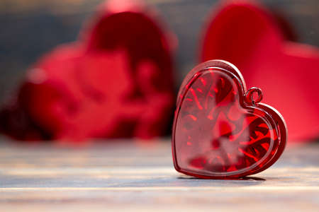 Valentine day greeting card. Hearts on the wooden backgroundの写真素材