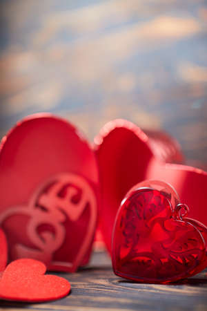 Valentine day greeting card. Hearts on the wooden backgroundの写真素材