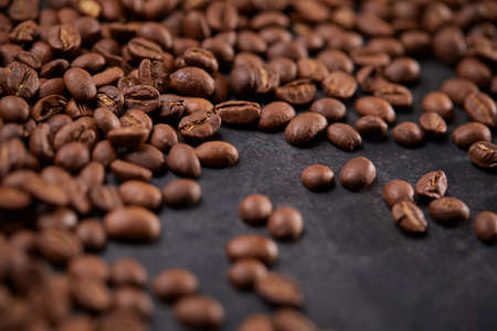 coffee beans on the wooden backgroundの写真素材