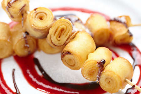 fried sweet rolls with sauceの写真素材