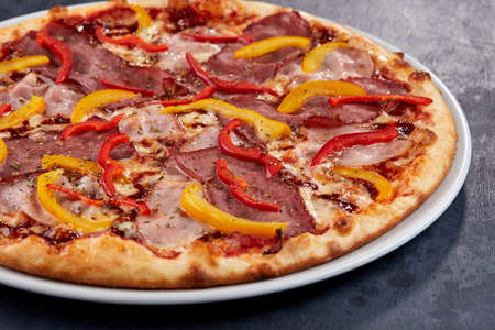 Italian pizza on the white plateの写真素材
