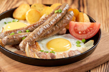 baked potato with sausage and eggの写真素材