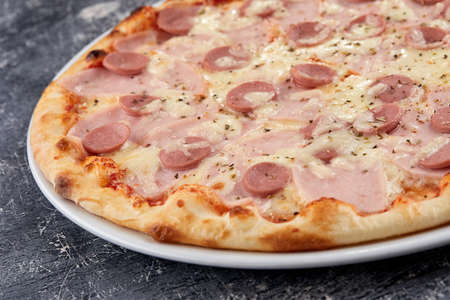 Italian pizza on the white plateの写真素材