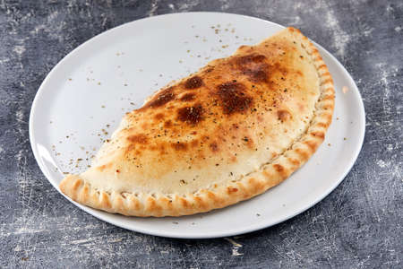 Italian pizza on the white plateの写真素材