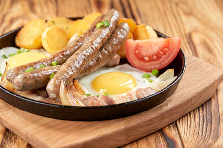 baked potato with sausage and eggの写真素材