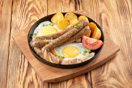 baked potato with sausage and eggの写真素材