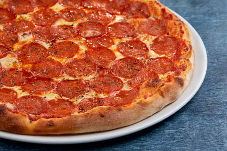 Italian pizza on the white plateの写真素材