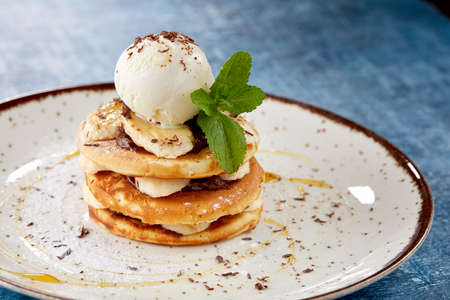 pancakes with ice cream and bananaの写真素材