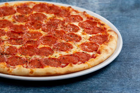 Italian pizza on the white plateの写真素材