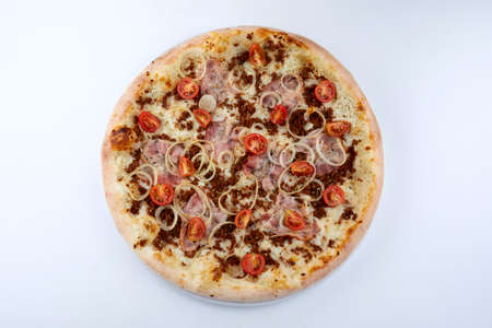 pizza with meat and cherry tomatoの写真素材