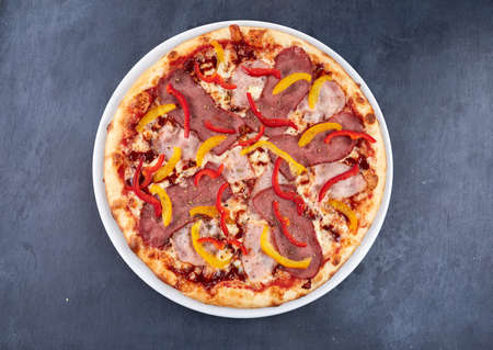 Italian pizza on the white plateの写真素材