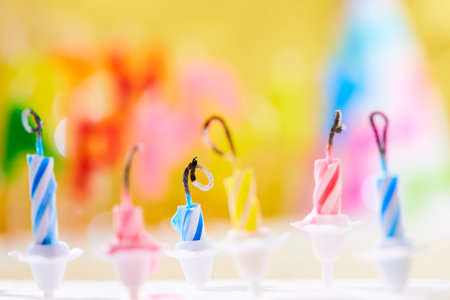 birthday candles on yellow backgroundの写真素材