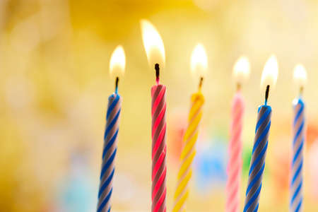 birthday candles on yellow backgroundの写真素材