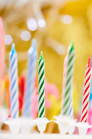 birthday candles on yellow backgroundの写真素材