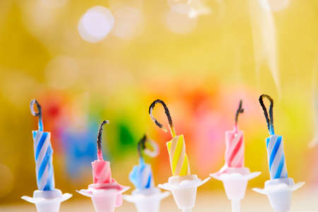 birthday candles on yellow backgroundの写真素材