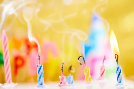 birthday candles on yellow backgroundの写真素材