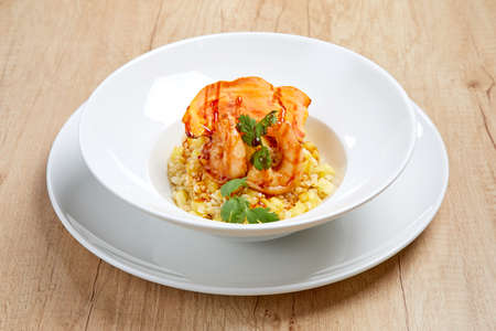 Yellow fried rice with shrimp and herbsの写真素材