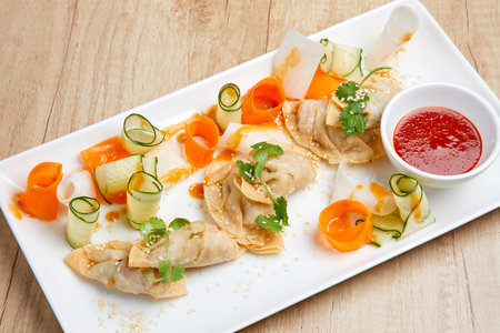 Closeup of fried spring rolls with carrotの写真素材