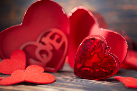 Valentine day greeting card. Hearts on the wooden backgroundの写真素材