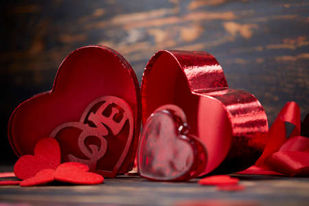 Valentine day greeting card. Hearts on the wooden backgroundの写真素材