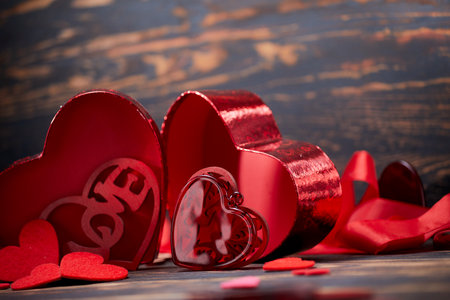Valentine day greeting card. Hearts on the wooden backgroundの写真素材