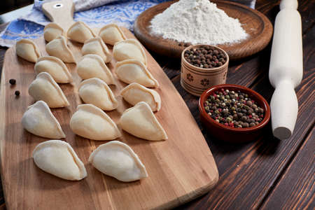 raw dumplings on the wooden boardの写真素材