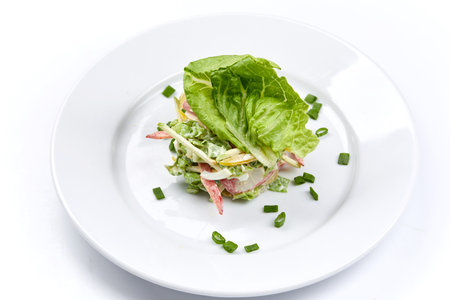 fresh vegetarian salad on the white plateの写真素材
