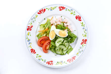 salad with egg on the white backgroundの写真素材
