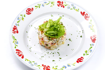 Russian salad on the white backgroundの写真素材