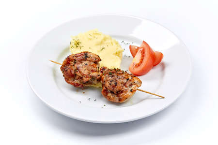 pork kebab with mashed potatoes and vegetablesの写真素材