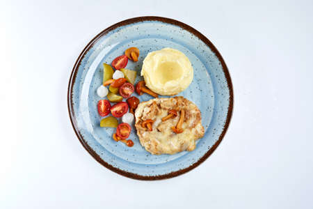 pork with mashed potatoes and vegetablesの写真素材