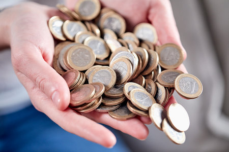 euro coins in the handsの写真素材