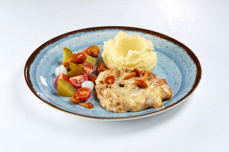 pork with mashed potatoes and vegetablesの写真素材