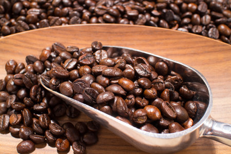 coffee beans in the spoonの写真素材
