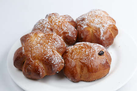 baked sweet buns on the white plateの写真素材
