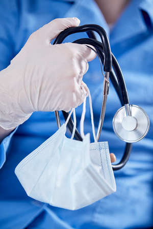 Male Doctor with stethoscope and maskの写真素材
